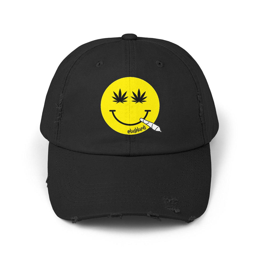 Nice Jay Smiley Face Distressed Dad Hat featuring a playful yellow smiley face with cannabis leaves for eyes and a rolled joint in the mouth, on a black cotton twill cap.