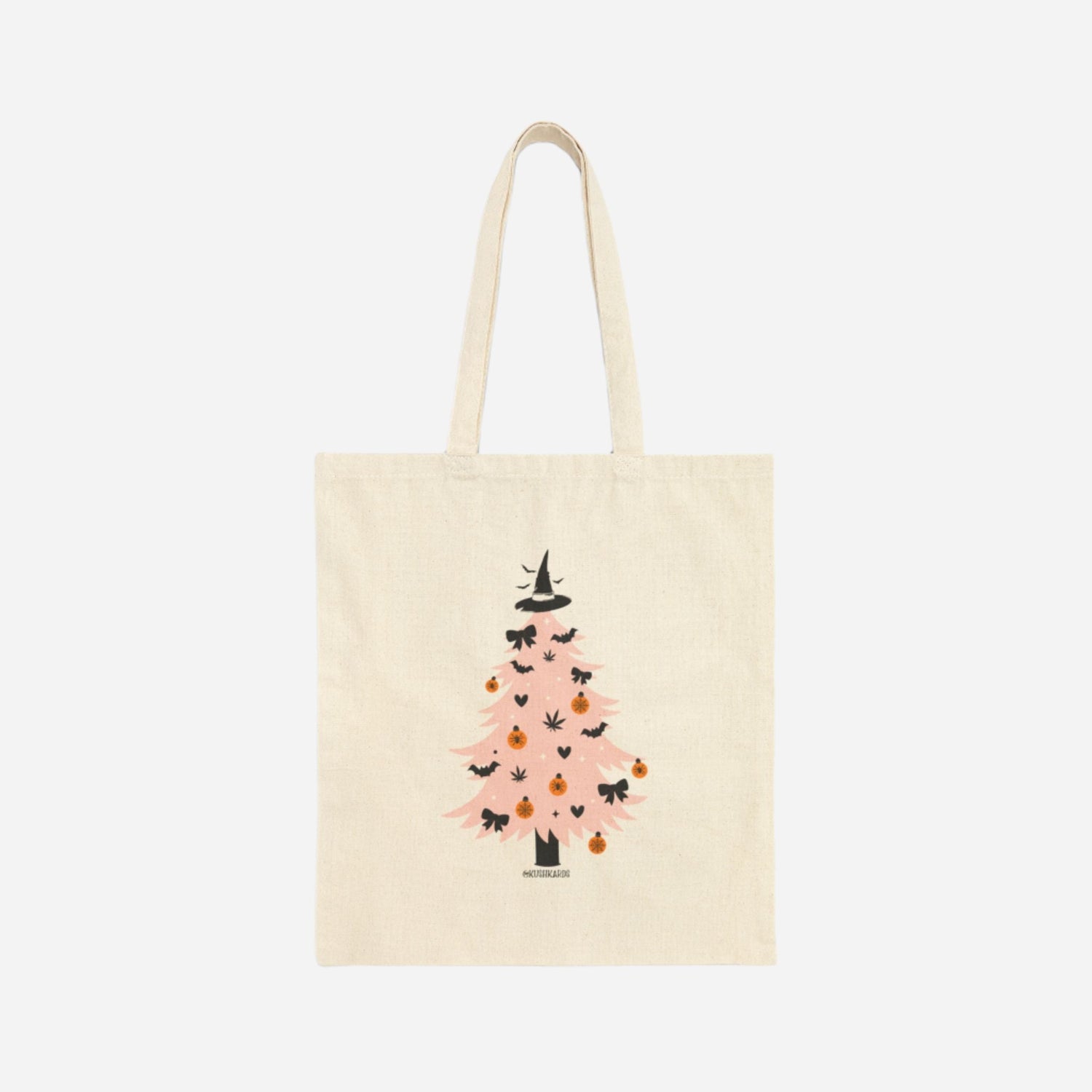 Back of the Witchy Tree Cotton Canvas Tote Bag showcasing a pink Halloween tree decorated with bats, pumpkins, bows, and topped with a witch hat.