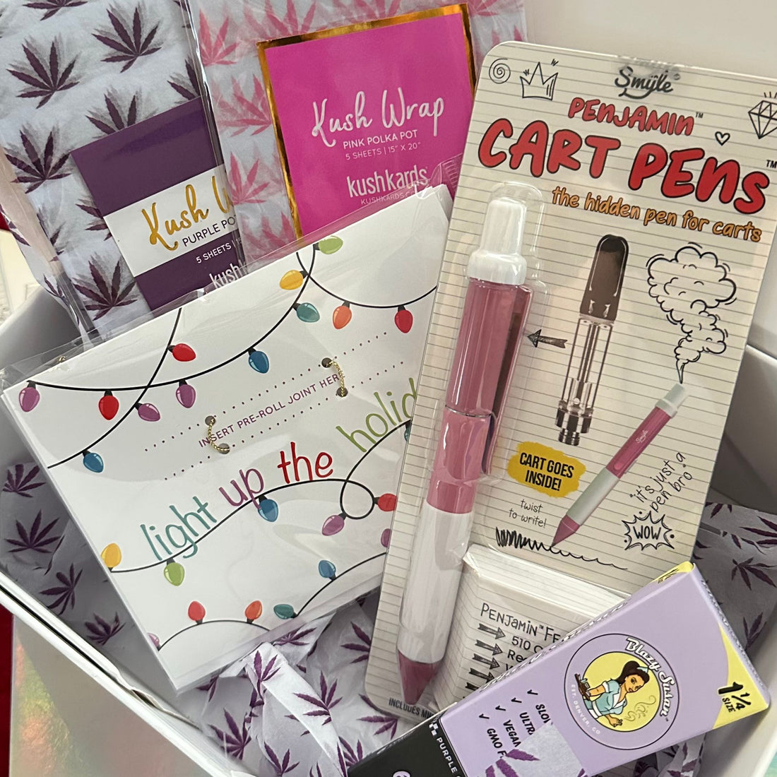 Light Up the Holidays Gift Box Full Set: &quot;Light Up the Holidays Gift Box Set featuring a KushKard, Penjamin Cart Pen, Blazy Susan Purple Cones, Kush Wraps, and a lavender gift box. 🎁🎄🍃&quot;