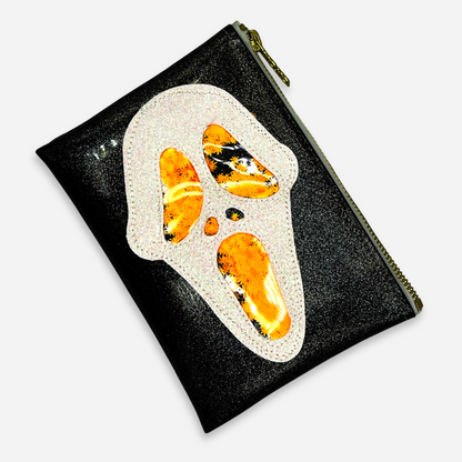 Midi Ghostface Clutch with orange glitter cannabis leaf, angled view for ghostface Halloween costume