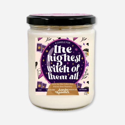 A clean product shot of the Highest Witch of Them All Rosemary &amp; Eucalyptus Soy Wax Candle in a glass jar with a black lid. The label highlights the spellbinding blend of rosemary, eucalyptus, mint, and citrus with a 90-hour burn time.