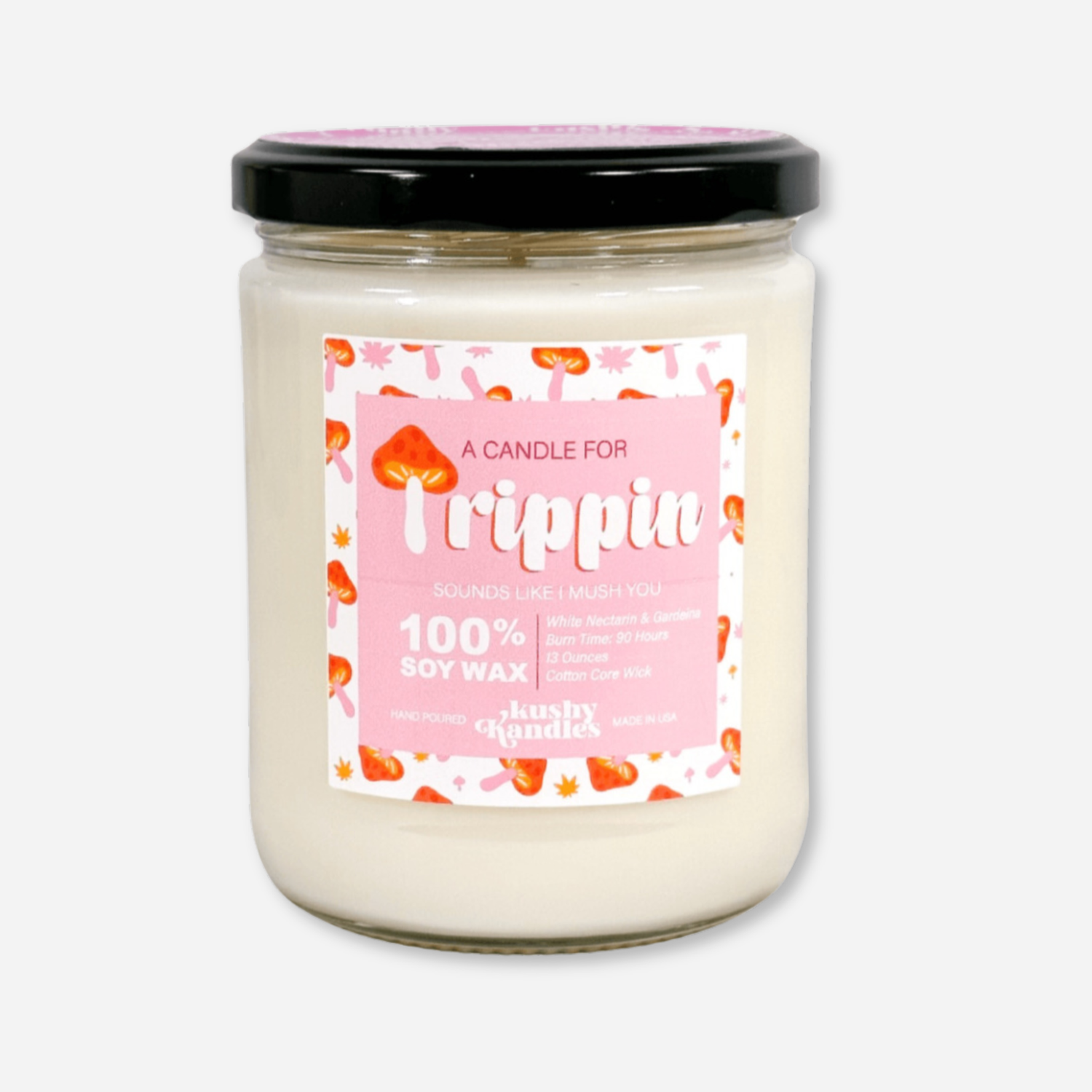 A clean product shot of the &quot;Trippin&quot; soy wax candle in a glass jar with a black lid. The label highlights white nectarine and gardenia scent, with a 90-hour burn time and 100% soy wax formula.