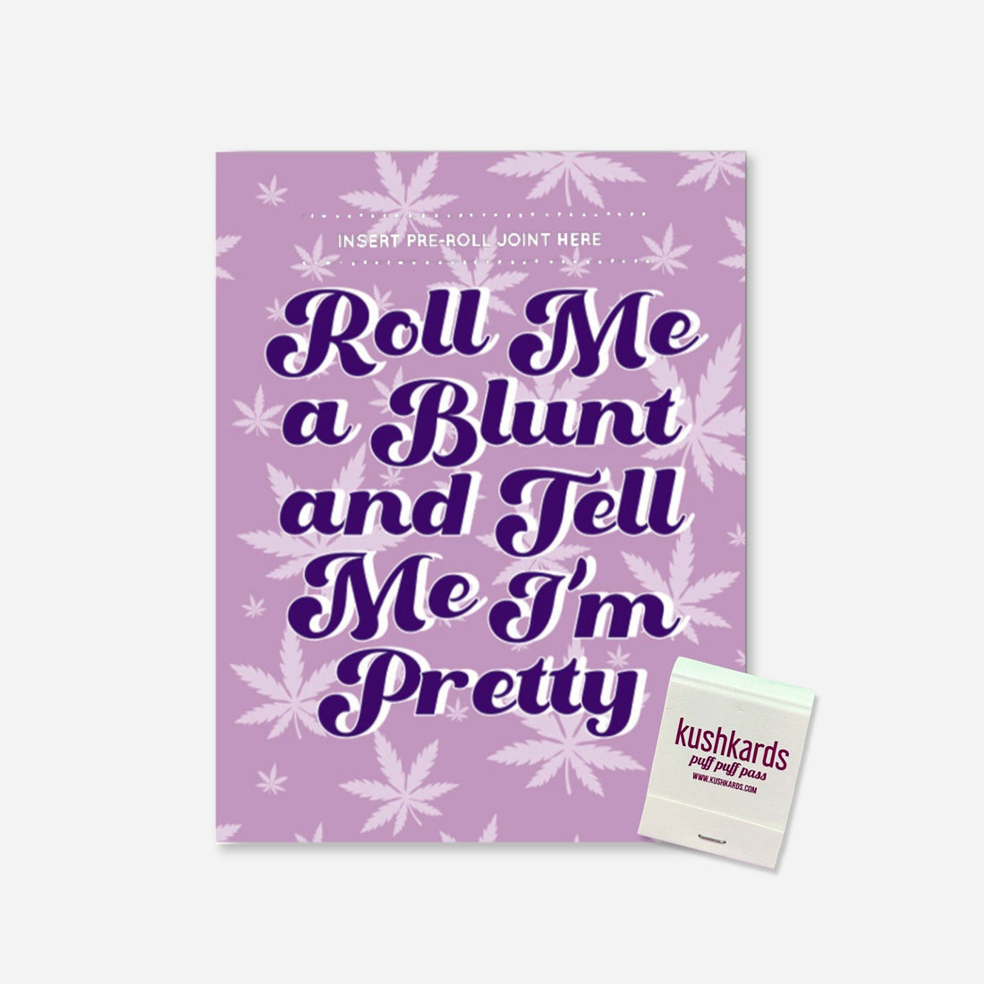 A playful cannabis-themed greeting card with bold text saying &quot;Roll Me a Blunt and Tell Me I’m Pretty,&quot; set against a purple background with leafy motifs