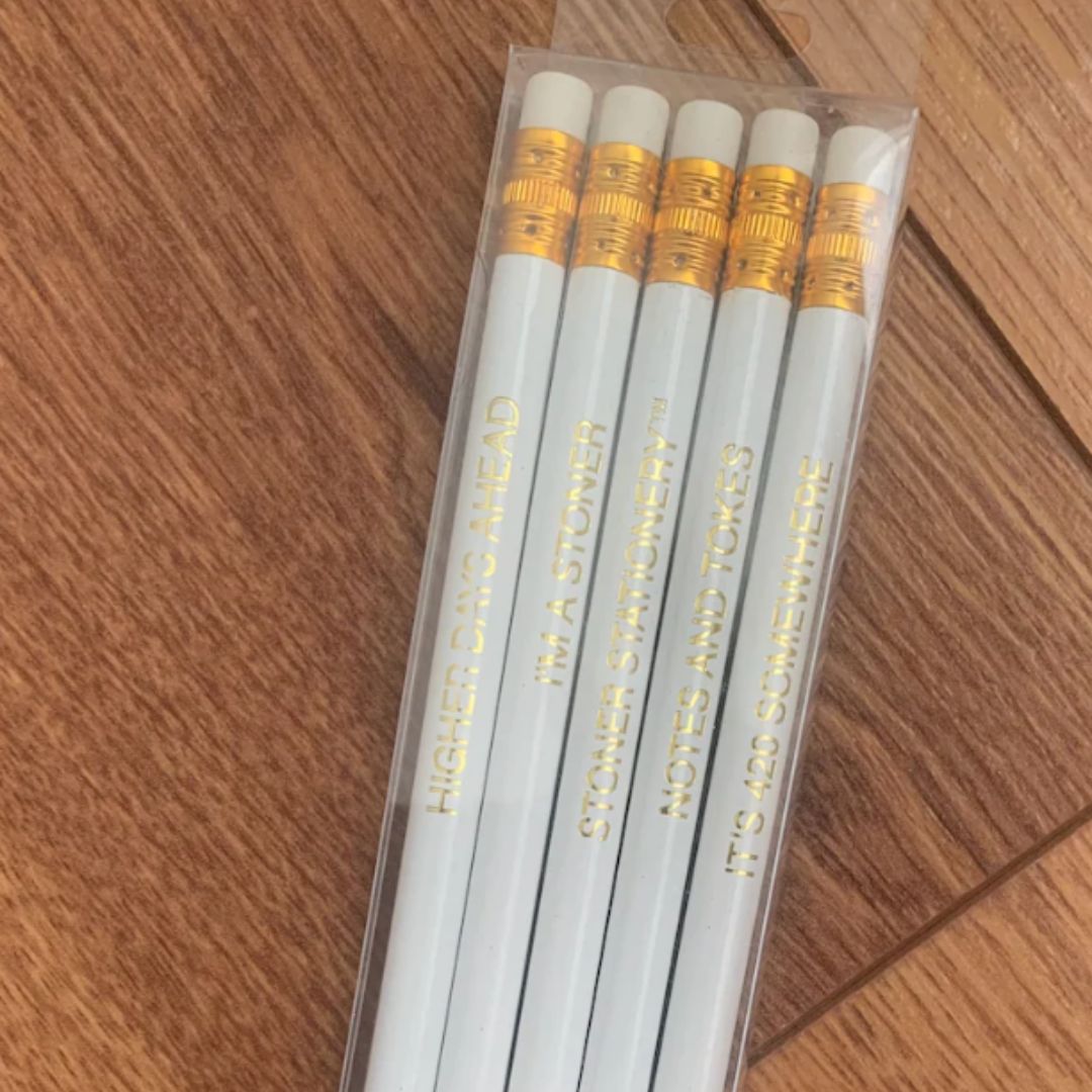 Stoner-themed pencil set with gold foil phrases, perfect for cannabis lovers.
