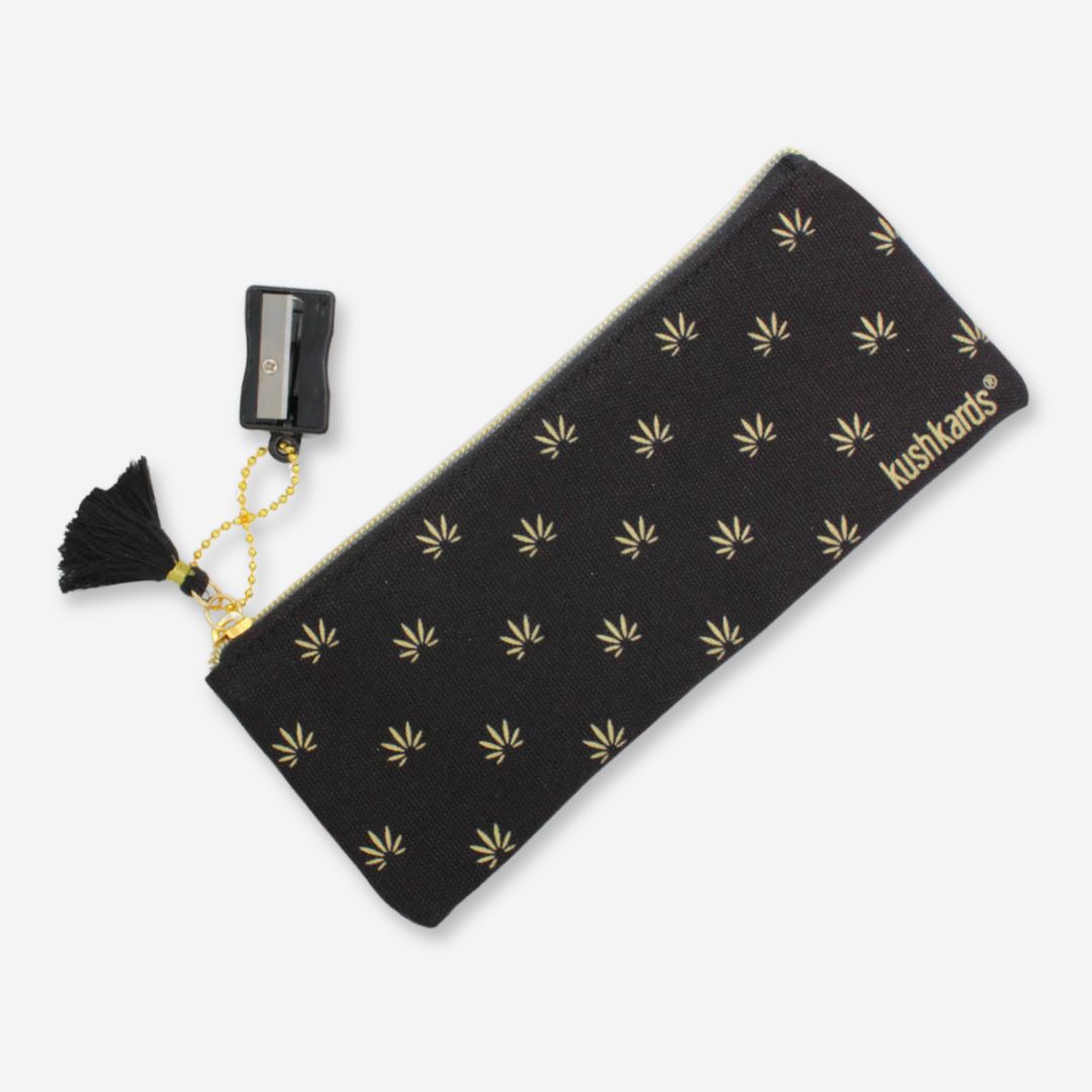 8&quot; x 3&quot; black pencil pouch with gold cannabis leaves, tassel, and attached pencil sharpener.