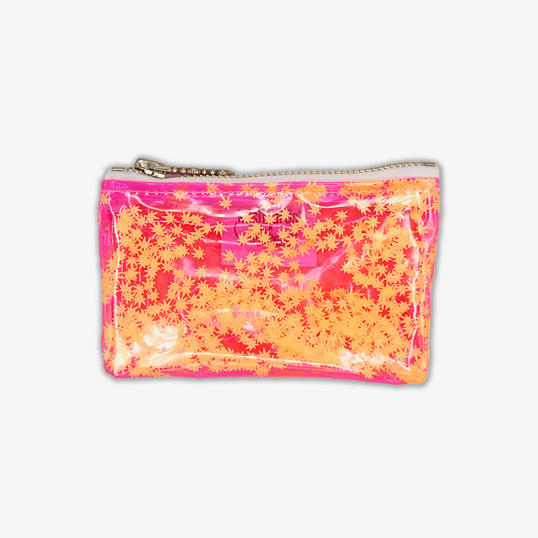 A vibrant, clear vinyl keychain clutch filled with floating orange cannabis leaf confetti. Designed by Julie Mollo in collaboration with KushKards, this playful mini bag features a pink trim and a silver zipper, making it a stylish stash for essentia