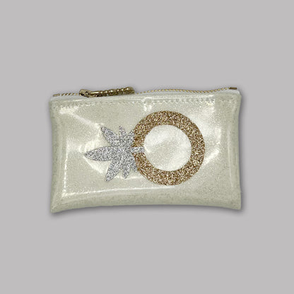 Glittery cannabis-themed wedding ring clutch by KushKards x Julie Mollo, featuring a silver weed leaf and gold engagement ring on a pearl white background.